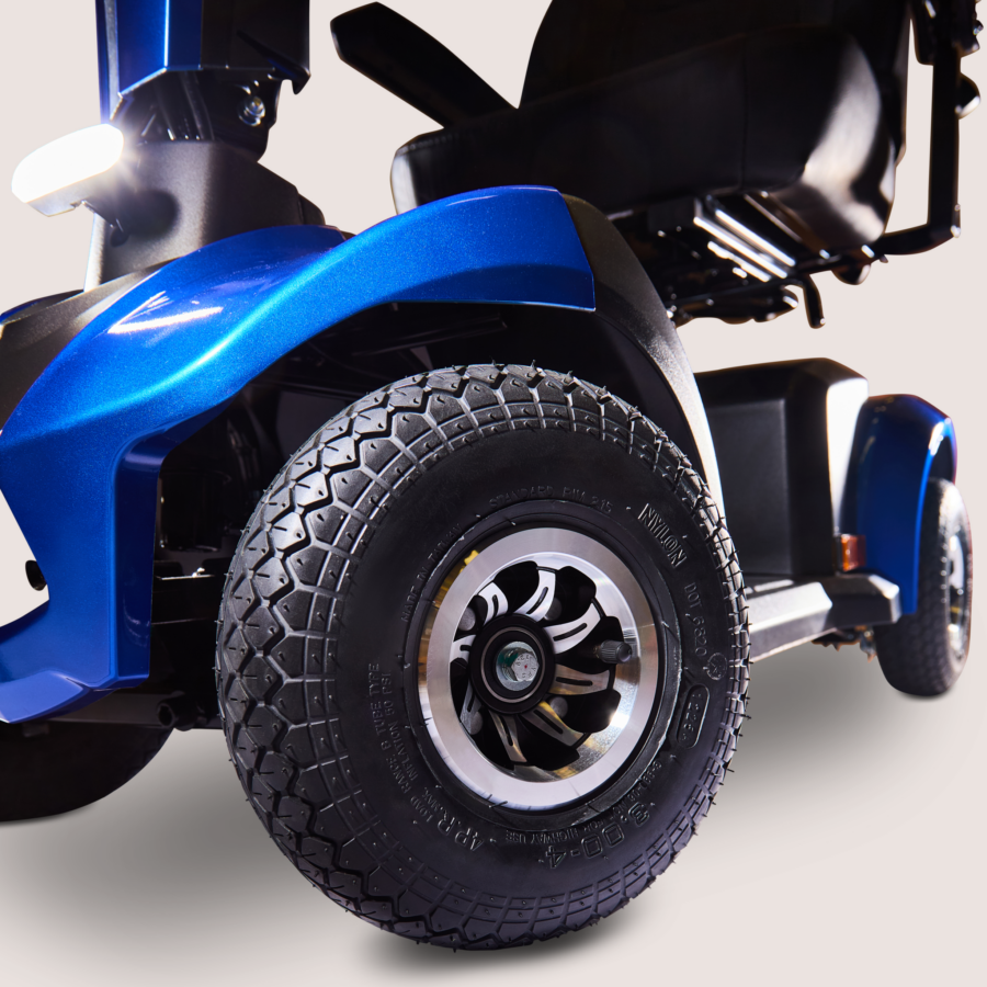 Close up on the wheel and headlight of a blue Humfree urban scooter