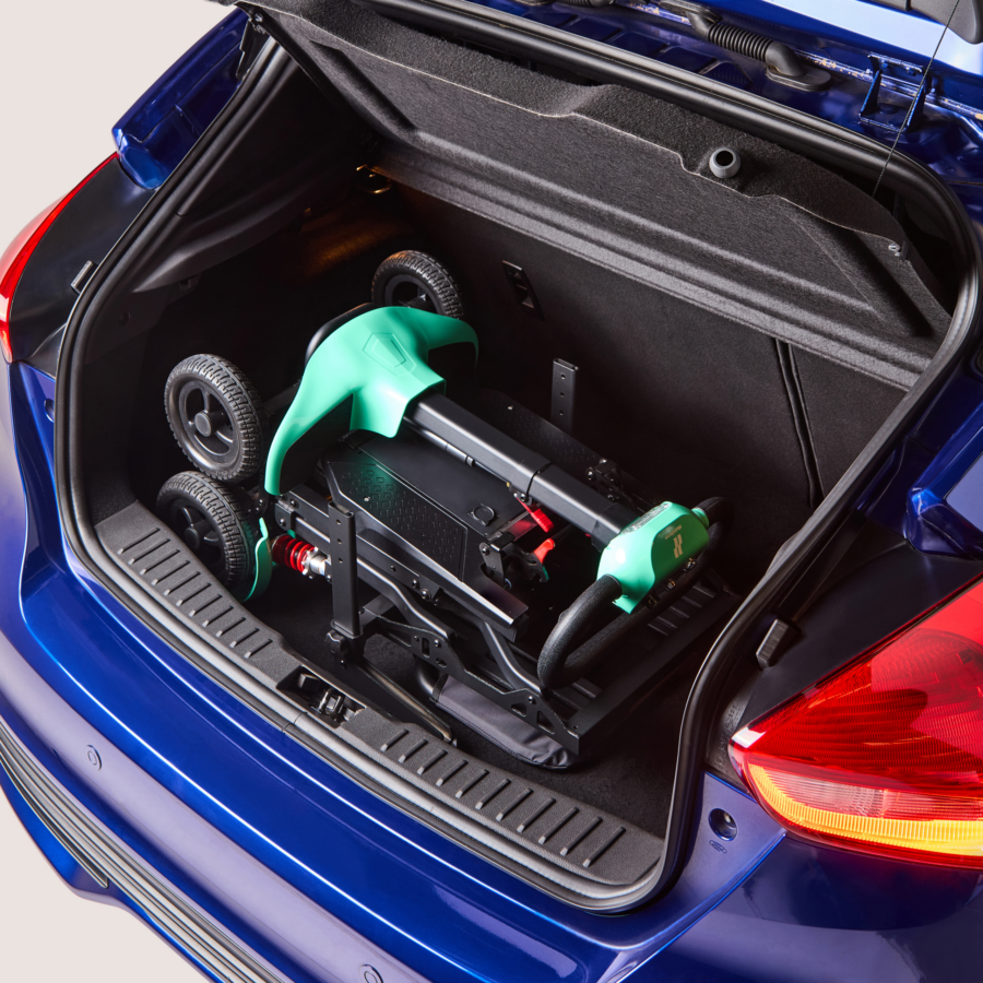 Teal Humfree fold scooter in open boot