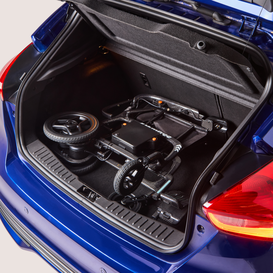 Charcoal Humfree glide powerchair in open car boot